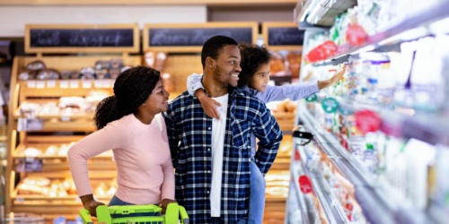 A happy family shopping together at the grocery store